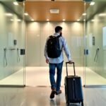 Traveler heading to airport shower facility