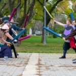 a group of people playing a game of baseball