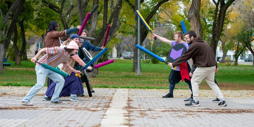 a group of people playing a game of baseball