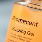 Bottle of Promescent Buzzing Gel with a warm glow.